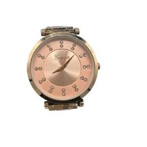 Geneva wristwatch with rhinestone accents.